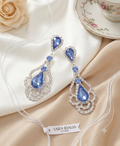 Aretes colgantes de gala con cristal azul profundo